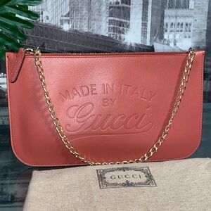Authentic Gucci Coral Pink Leather Pochette Clutch with Embossed Logo